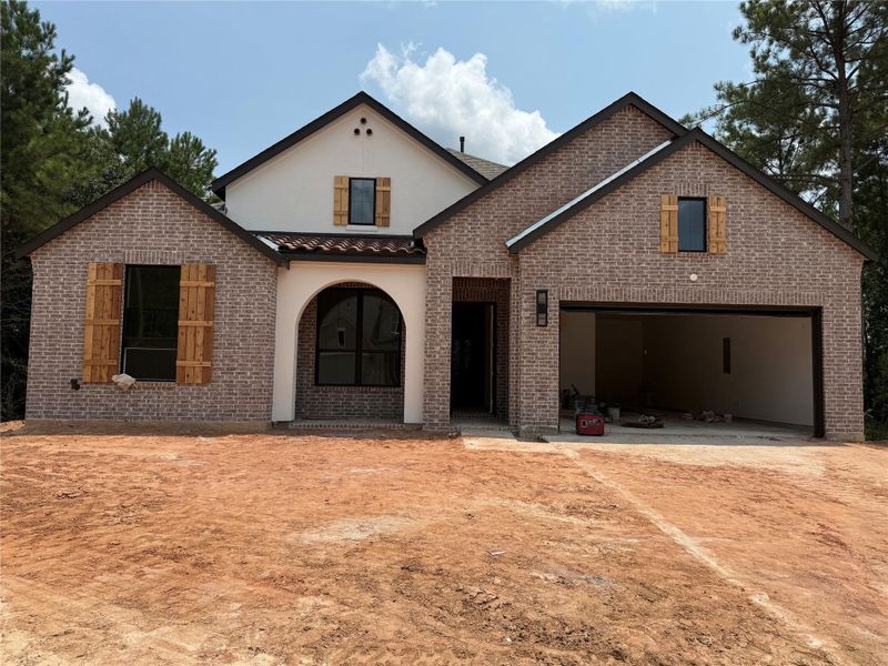 Front exterior of a new home in COLTON: 60ft. lots, Magnolia, TX, highlighting curb appeal (Image 6). Front exterior of a new home in COLTON: 60ft. lots, Magnolia, TX, highlighting curb appeal (Image 6).