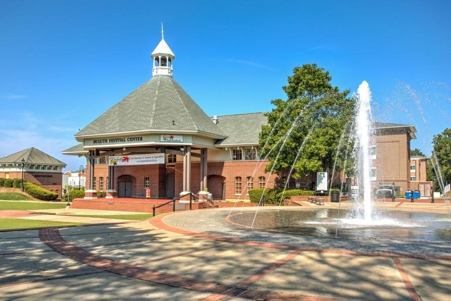 Front exterior of a new home in Riversong, Duluth, GA, highlighting curb appeal (Image 20).