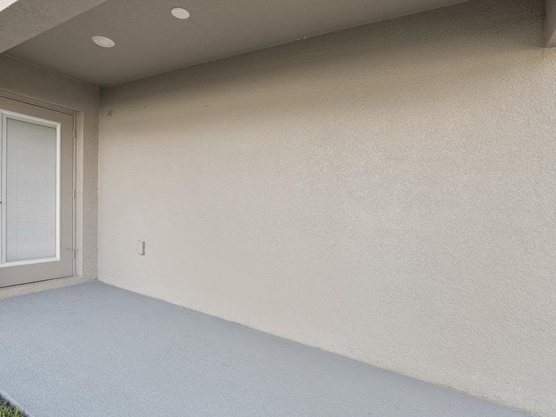 Your interior opens to outdoor living space on a covered lanai - Begonia by Highland Homes