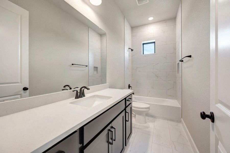 Furnished interior view inside a new home in Sienna - Landmark Row Collection, Missouri City (Image 8). Furnished interior view inside a new home in Sienna - Landmark Row Collection, Missouri City (Image 8).