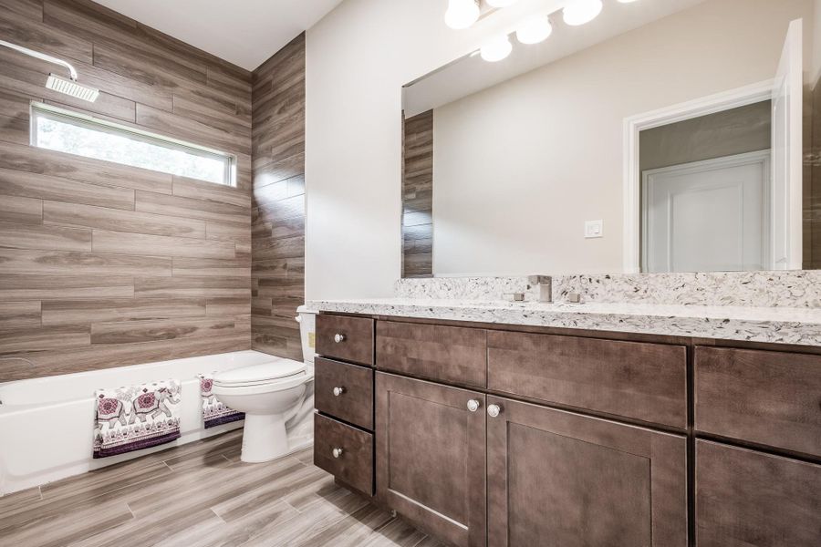 Contemporary full bath with tile surround on first floor. Contemporary full bath with tile surround on first floor.