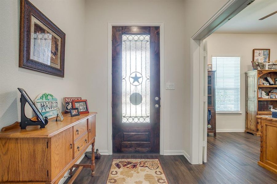 Entrance foyer with dark wood finished floors and ceiling fan Entrance foyer with dark wood finished floors and ceiling fan