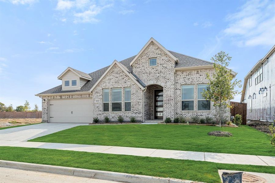 Front exterior of a new home in Wildflower Ranch 60-65, Fort Worth, TX, highlighting curb appeal (Image 1). Front exterior of a new home in Wildflower Ranch 60-65, Fort Worth, TX, highlighting curb appeal (Image 1).