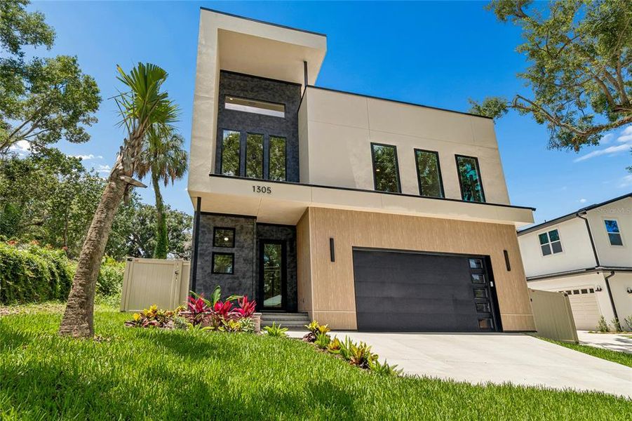 Front exterior of a new home in , Tampa, FL, highlighting curb appeal (Image 32).