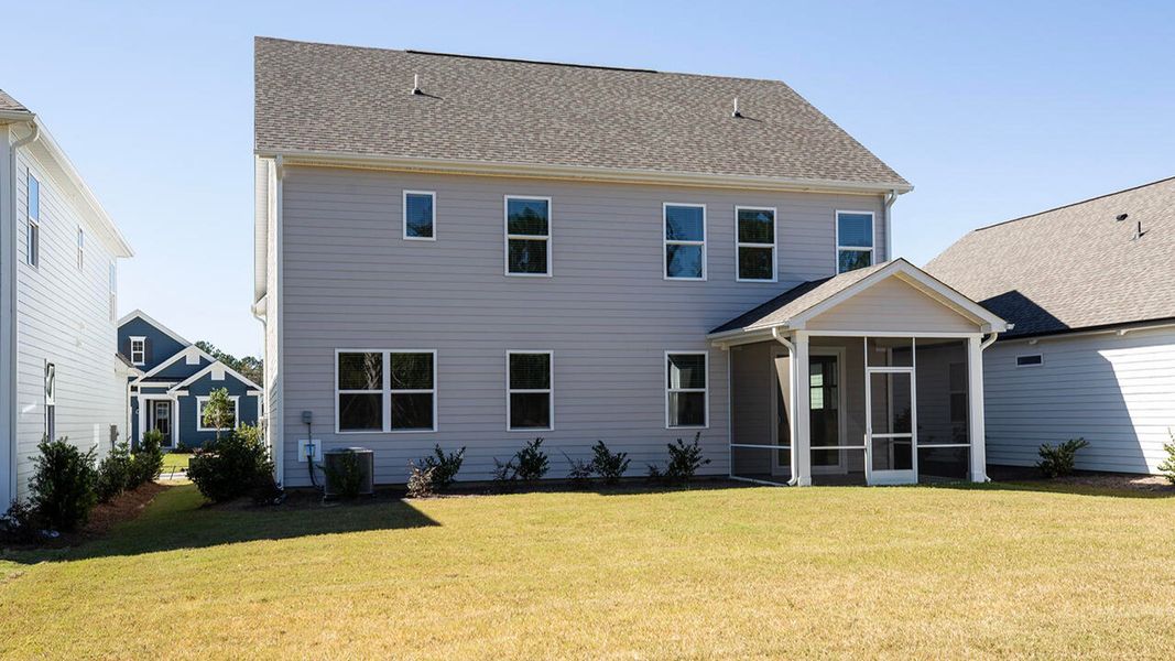 Exterior details and patio area of a home in Indigo Preserve, Leland (Image 22).