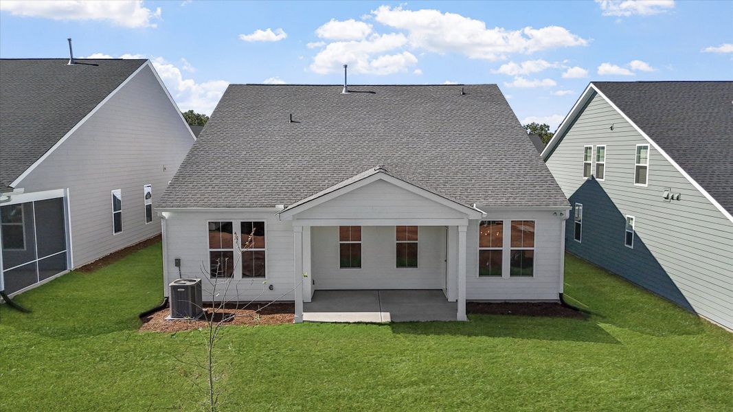 Exterior details and patio area of a home in Ovation at Sweetbrier, Durham (Image 4).