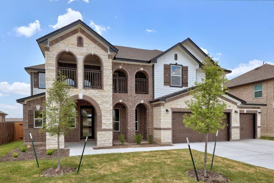 Front exterior of a new home in Salerno - Hallmark Collection, Round Rock, TX, highlighting curb appeal (Image 21).