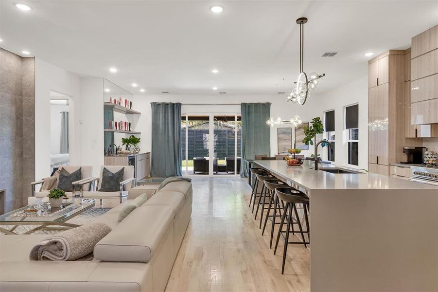 Living room featuring light hardwood / wood-style flooring and sink