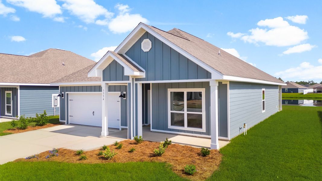 Front exterior of a new home in Hodges Bayou Plantation, Panama City, FL, highlighting curb appeal (Image 16). Front exterior of a new home in Hodges Bayou Plantation, Panama City, FL, highlighting curb appeal (Image 16).