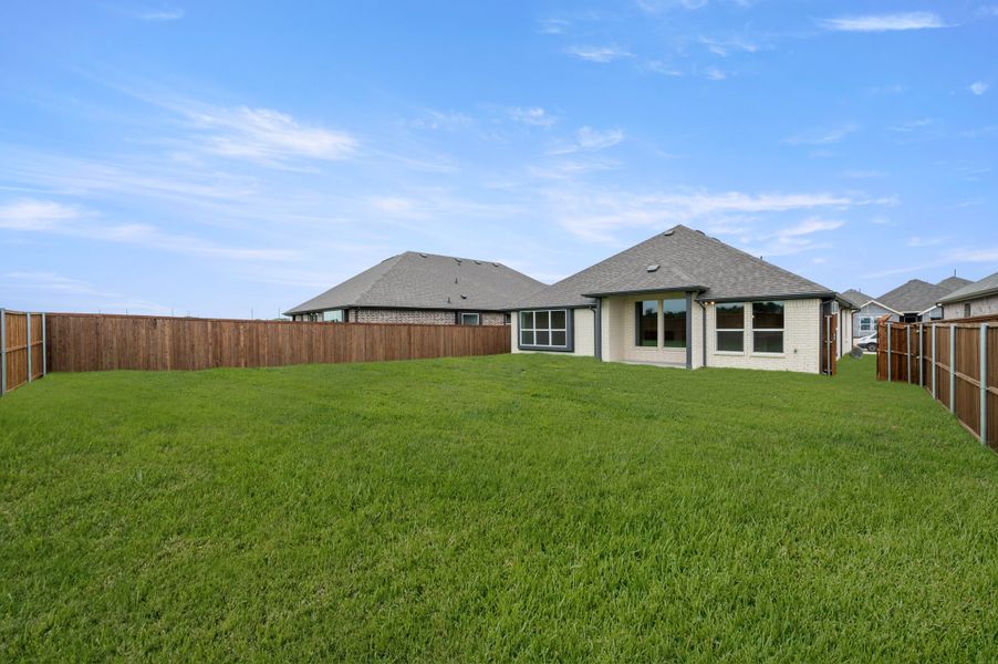 Exterior details and patio area of a home in Meadow Park at The Meadows, Ponder (Image 21).