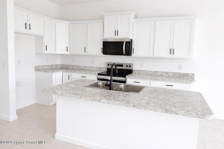Furnished interior view inside a new home in St. John's Preserve, Palm Bay (Image 5).
