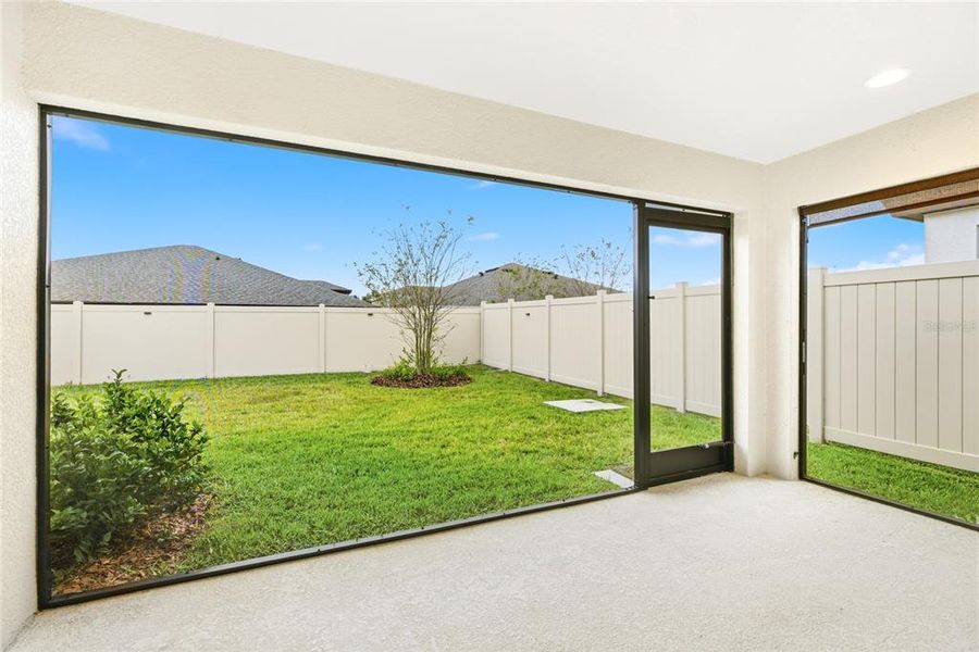 Exterior details and patio area of a home in Crosswind Point, Parrish (Image 26).