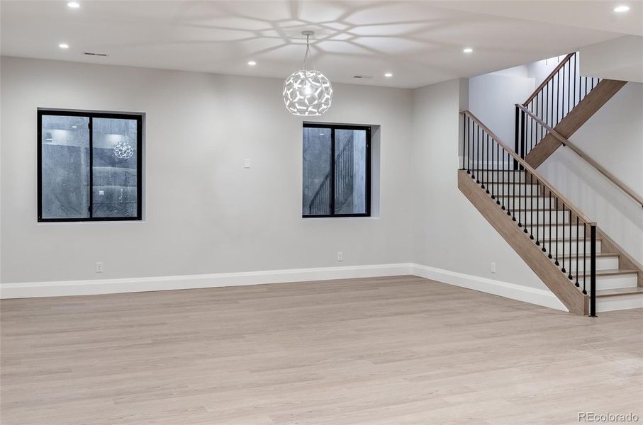Finished basement with large rec room and wet bar