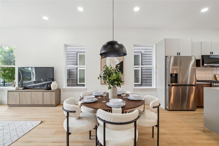 Warm LVP flooring and soft, neutral cabinetry create a calming backdrop for connection—perfect for everyday living or welcoming guests. Warm LVP flooring and soft, neutral cabinetry create a calming backdrop for connection—perfect for everyday living or welcoming guests.