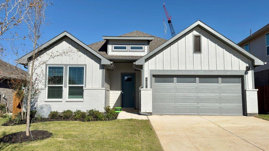 Front exterior of a new home in Eagle Creek, Denton, TX, highlighting curb appeal (Image 1).