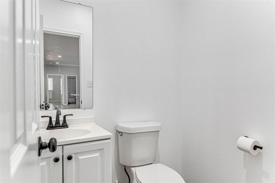 Bathroom with toilet and vanity