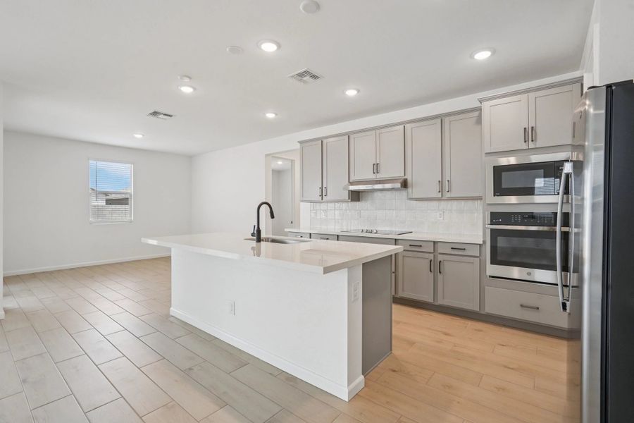 Gourmet kitchen featuring the Harmony Collection and dining