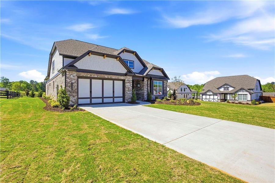 Front exterior of a new home in Yellowstone Farms, Cumming, GA, highlighting curb appeal (Image 22).