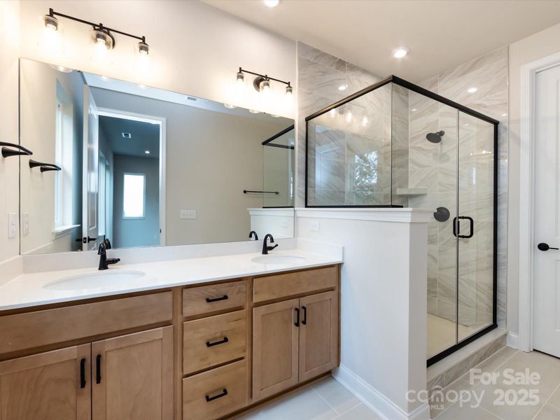 Primary En Suite Bath with Dual Vanity and Loads of Storage.