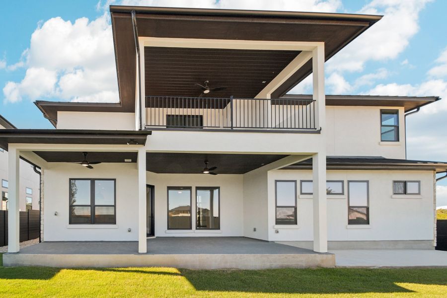 Exterior details and patio area of a home in Milky Way at River Place, Austin (Image 25).