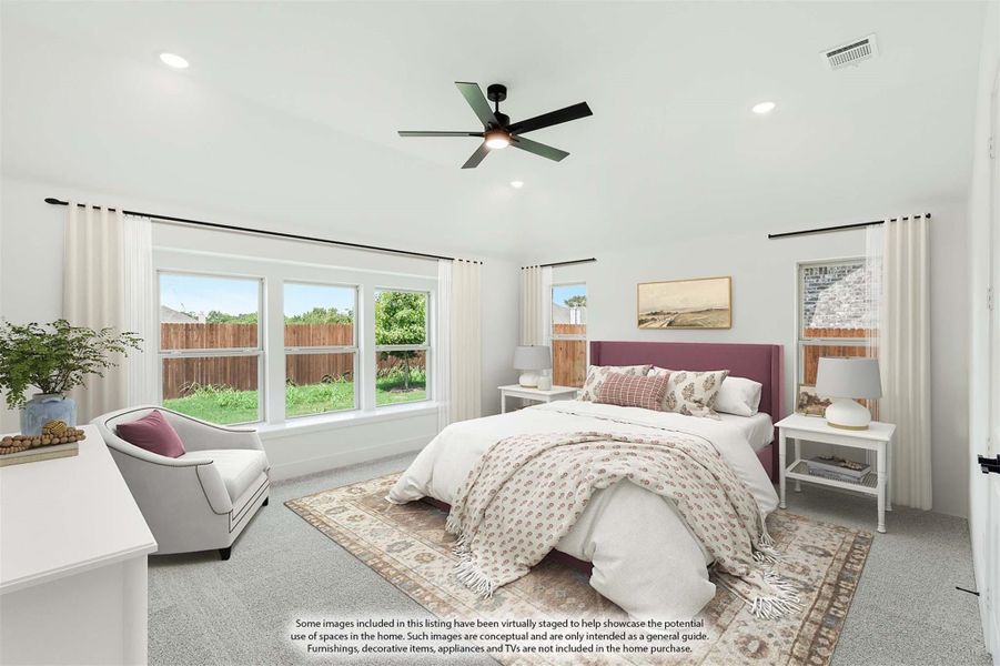 Spacious bedroom with vaulted ceiling, ceiling fan, carpet flooring, and large windows overlooking backyard Spacious bedroom with vaulted ceiling, ceiling fan, carpet flooring, and large windows overlooking backyard