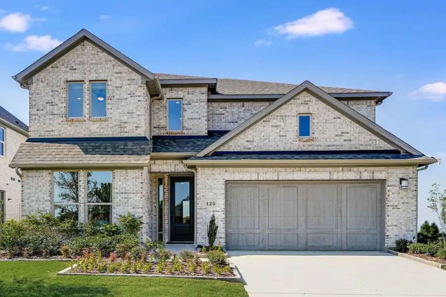 Front exterior of a new home in South Oak 50s, Lakewood Village, TX, highlighting curb appeal (Image 1).