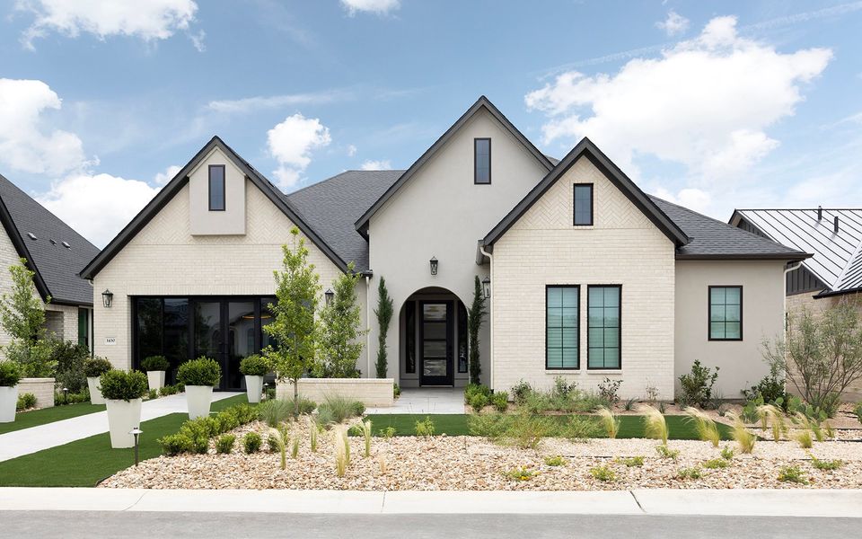 Representative exterior photo of a completed home built from the Champlain by Brookfield Residential in Kissing Tree, San Marcos, TX (Image 15).