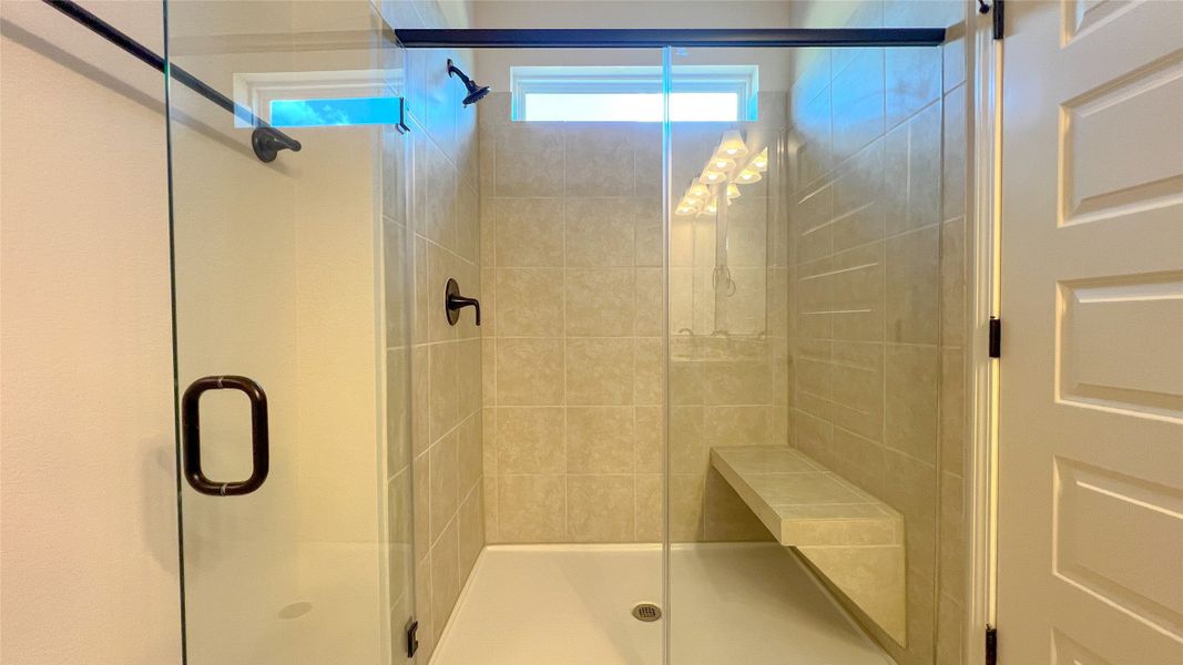 The Blue Jay II- Primary Bathroom with Large Walk-in Shower with Bench Seat The Blue Jay II- Primary Bathroom with Large Walk-in Shower with Bench Seat