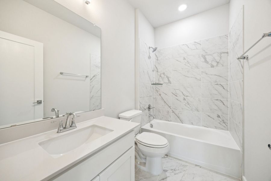 Bathroom in the Wimbledon home plan by Trophy Signature Homes – REPRESENTATIVE PHOTO