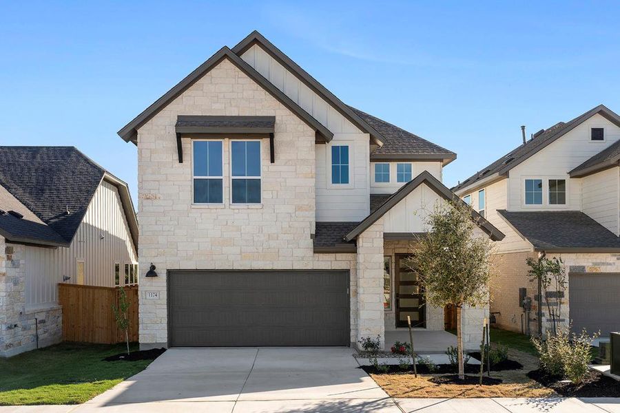 Front exterior of a new home in Terrace Collection at Heritage, Dripping Springs, TX, highlighting curb appeal (Image 23). Front exterior of a new home in Terrace Collection at Heritage, Dripping Springs, TX, highlighting curb appeal (Image 23).