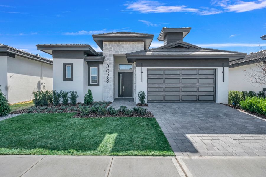 Representative exterior photo of a completed home built from the Courtyard 50 by ABD Development in Hampton Green at Providence, Davenport, FL (Image 29).