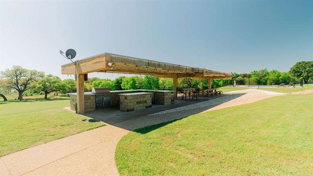 View of community featuring area for grilling, a patio area, and a yard