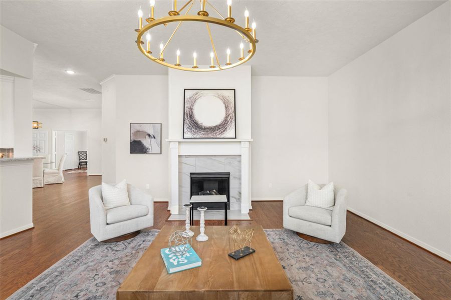 The luxurious gas-log fireplace features an elegant marble surround. The luxurious gas-log fireplace features an elegant marble surround.