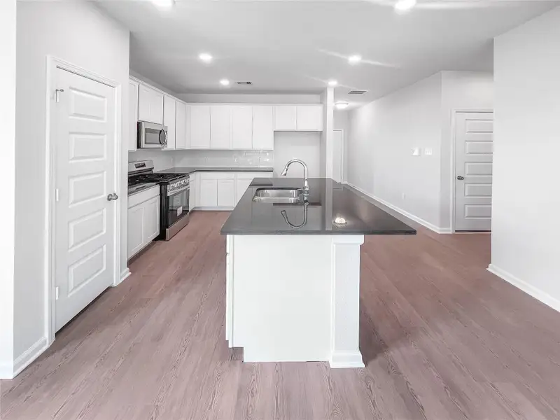 The Waring III- Kitchen with Large Island. Sample image for illustration; upgrades, options, and colors may vary. The Waring III- Kitchen with Large Island. Sample image for illustration; upgrades, options, and colors may vary.