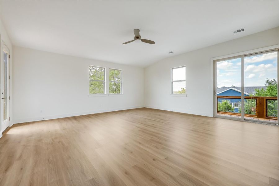 Spare room with light wood-style flooring and ceiling fan