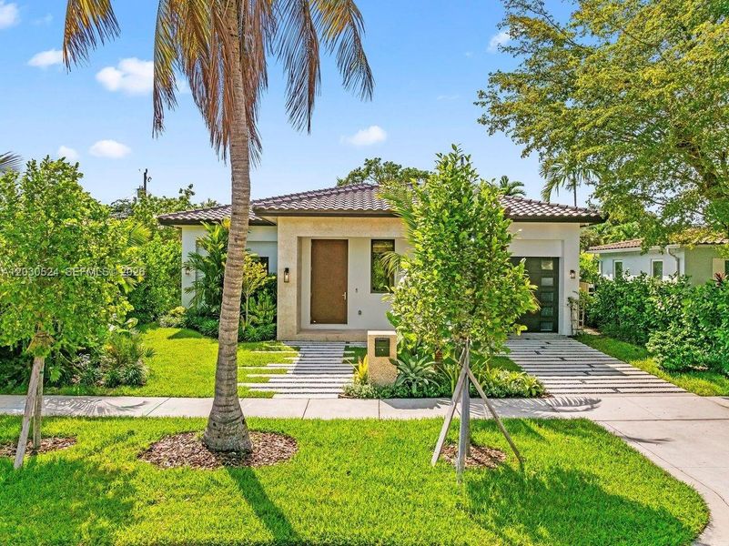 Front exterior of a new home in , Miami, FL, highlighting curb appeal (Image 1). Front exterior of a new home in , Miami, FL, highlighting curb appeal (Image 1).