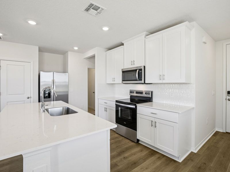 Furnished interior view inside a new home in The Reserve at Hammock Oaks Townes, Lady Lake (Image 4).