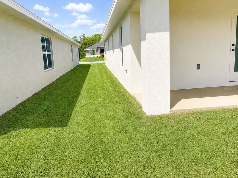 Exterior details and patio area of a home in Harmony Central, St. Cloud (Image 3).