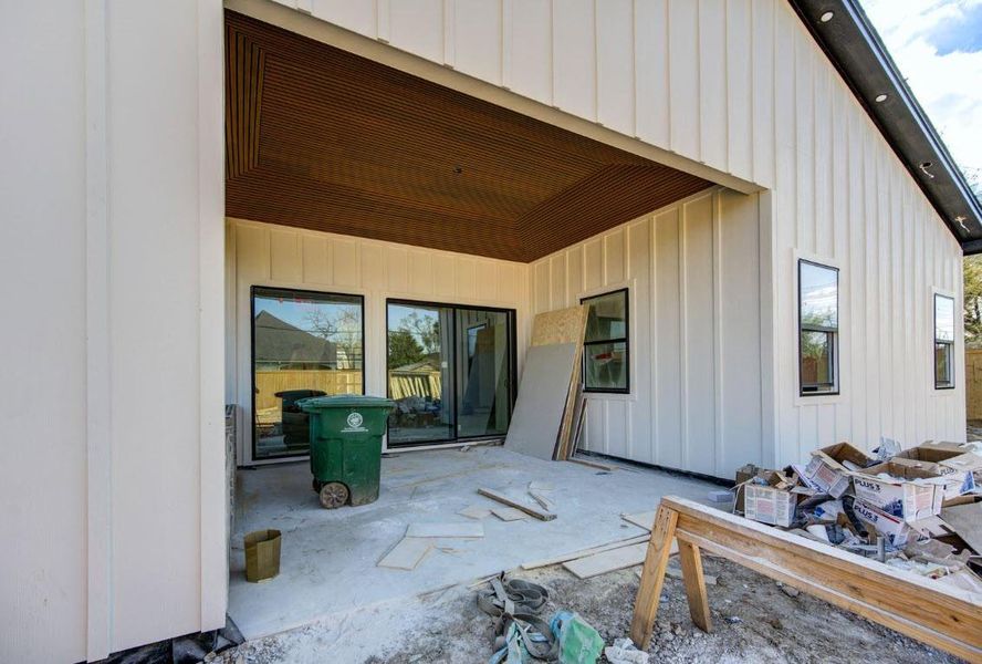 Outdoor kitchen with grill and sink, perfect for entertaining while overlooking the expansive backyard.