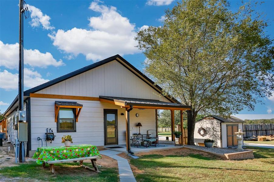 Side view of home with covered porch