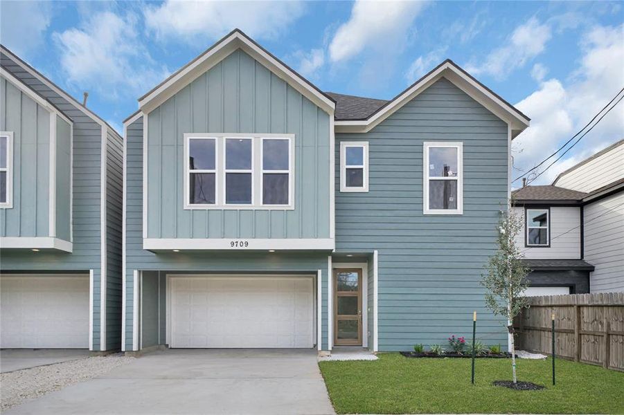 This modern, two-story home has a spacious two-car garage and a neatly landscaped front yard. Welcome to the neighborhood.