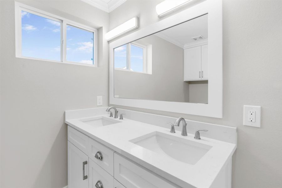Third full bath, located on the second floor. Double sinks and framed mirror Third full bath, located on the second floor. Double sinks and framed mirror