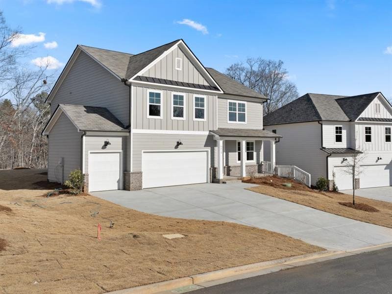 Front exterior of a new home in Falcon Landing, Gainesville, GA, highlighting curb appeal (Image 1).