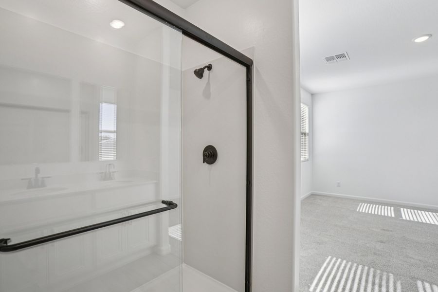Primary bath. Finishes and options may vary by community.