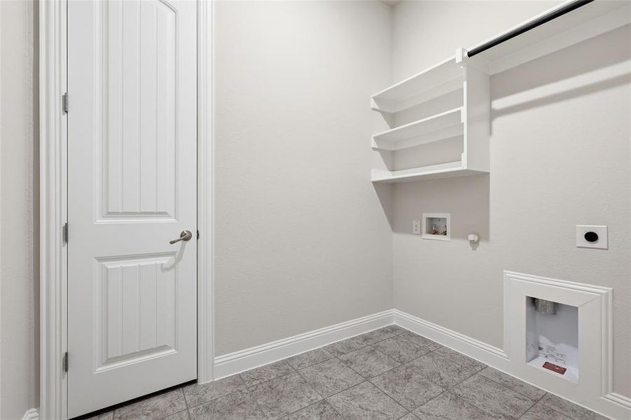 Laundry room with hookup for a gas dryer, washer hookup, and hookup for an electric dryer Laundry room with hookup for a gas dryer, washer hookup, and hookup for an electric dryer