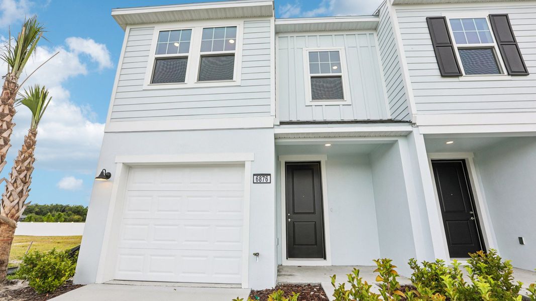 Front exterior of a new home in Twin Oaks, Zephyrhills, FL, highlighting curb appeal (Image 24).