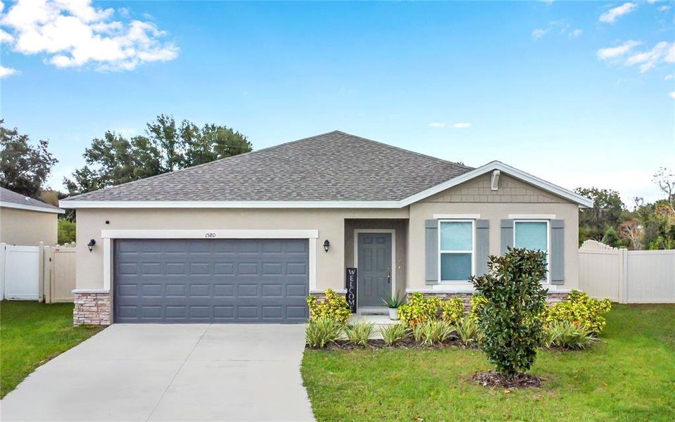 Front exterior of a new home in , Mascotte, FL, highlighting curb appeal (Image 22). Front exterior of a new home in , Mascotte, FL, highlighting curb appeal (Image 22).