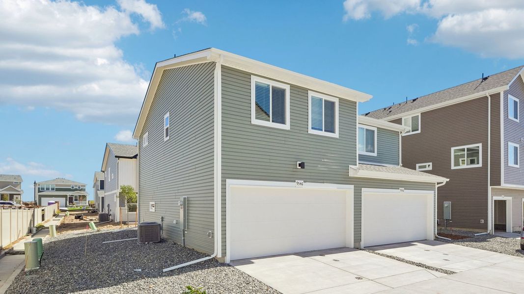 Front exterior of a new home in Banning Lewis Ranch, Colorado Springs, CO, highlighting curb appeal (Image 20).