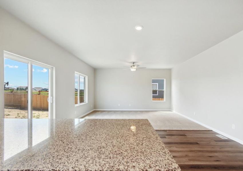 The dining room and family room of the Laramie sits right next to the kitchen.