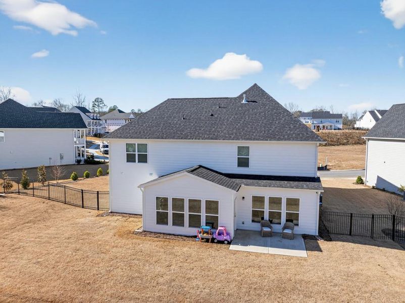 Exterior details and patio area of a home in Reunion, Flowery Branch (Image 31).
